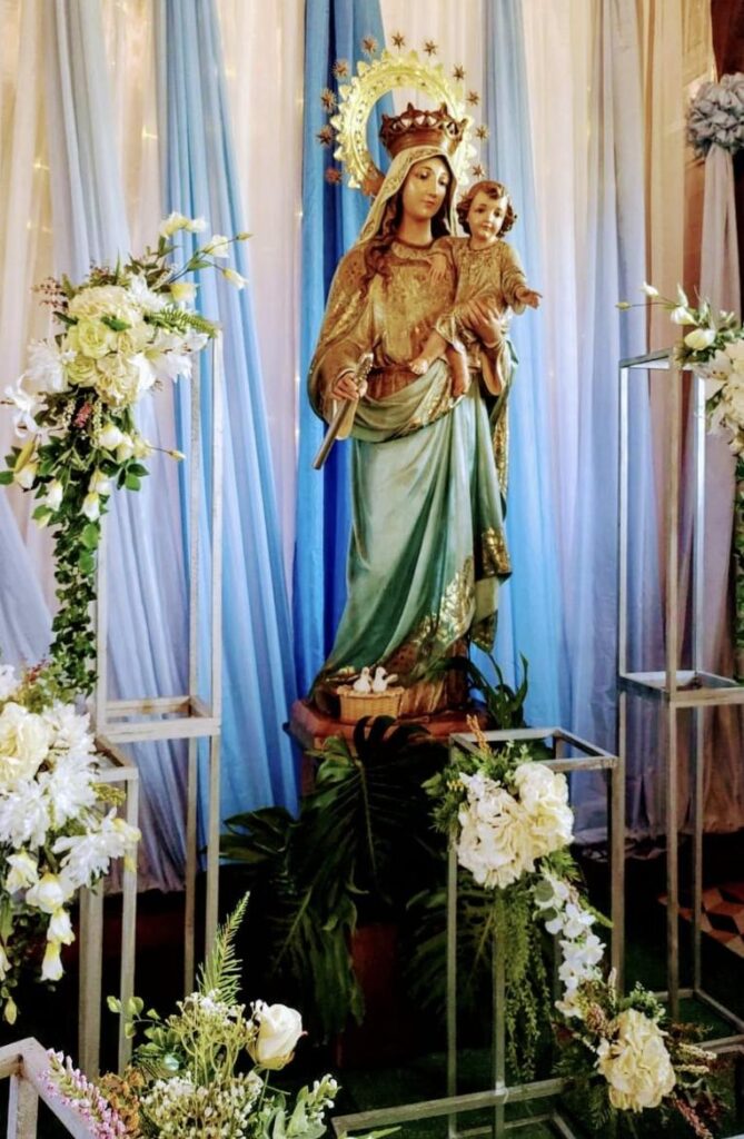 Nicoya residents celebrating Fiesta de la Candelaria with ox carts, music, and traditional costumes.